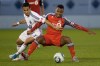 Vancouver Whitecaps' Camilo da Silva Sanvezzo, left, takes down Toronto FC's Julian de Guzman during game 1 Nutrilite Canadian Championship finals soccer action in Vancouver, B.C., on Wednesday May 18, 2011.&nbsp; THE CANADIAN PRESS/Geoff Howe