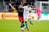 D.C. United defender Joseph Mora (28) defends against New England Revolution forward Tajon Buchanan (17) during the first half of an MLS soccer match, Wednesday, Oct. 20, 2021, in Washington.&nbsp; THE CANADIAN PRESS/AP-Alex Brandon