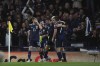 Scotland's John Souttar, center, celebrates after scoring his side's opening goal with his teammates during the World Cup 2022 group F qualifying soccer match between Scotland and Denmark at Hampden Park stadium in Glasgow, Scotland, Monday, Nov. 15, 2021. (AP Photo/Scott Heppell)