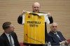 Cardinal Gianfranco Ravasi shows to journalists the jersey of the Vatican soccer team which will be donated to Pope Francis as he presents the soccer match between the Vatican soccer team 