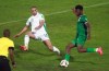 Burkina Faso's Edmond Tapsoba kicks the ball past Algeria's Islam Slimani during the World Cup 2022 group A qualifying soccer match between Algeria and Burkina Faso at the Mustapha Tchaker stadium in Blida, Algeria, Tuesday, Nov.16, 2021. The match ended in a 2-2 draw. (AP Photo/Fateh Guidoum)