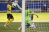 United States' Tim Weah, bottom, scores his side's opening goal against Jamaica during a qualifying soccer match for the FIFA World Cup Qatar 2022 in Kingston, Jamaica, Tuesday, Nov. 16, 2021. (AP Photo/Fernando Llano)