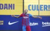 Dani Alves gestures wearing his new team shirt during his official presentation for FC Barcelona in Barcelona, Spain, Wednesday, Nov. 17, 2021. Veteran full back Dani Alves has returned to Barcelona at age 38 to finish out the rest of the season with the team. Alves formed part of Barcelona's greatest era from 2008 to 2016 and helped it win 23 titles, including three Champions League trophies and six Spanish leagues.(AP Photo/Joan Monfort)
