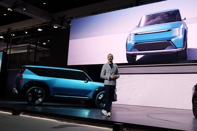 Karim Habib, head of Kia's Global design Center, introduces Kia's EV9 concept vehicle at the AutoMobility LA auto show Wednesday, Nov. 17, 2021, in Los Angeles. (AP Photo/Marcio Jose Sanchez)