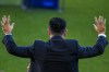 FC Barcelona's new signing coach Xavi Hernandez waves to the crowd during his official presentation at the Camp Nou stadium in Barcelona, Spain, Monday, Nov. 8, 2021. Xavi, who thrived in Barcelona's midfield alongside Messi and Andres Iniesta, was officially introduced as coach on the field of the Camp Nou with a reception usually only offered to top players. (AP Photo/Joan Monfort)