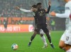 Augsburg's Jan Moravek, back, and Bayern's Alphonso Davies battle for the ball during the German Bundesliga soccer match between FC Augsburg and Bayern Munich at the WWK Arena in Augsburg, Germany, Friday, Nov. 19, 2021. (Matthias Balk/dpa via AP)