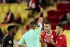 Referee Willy Delajod, second left, shows a red card to Monaco's Strahinja Pavlovic, second right, during the French League One soccer match between Monaco and Lille at the Stade Louis II in Monaco, Friday, Nov. 19, 2021. (AP Photo/Daniel Cole)