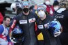 Francesco Friedrich, right, and Alexander Schueller of Germany pose after winning the men's two-man bobsleigh World Cup race in Igls, near Innsbruck, Austria, Saturday, Nov. 20, 2021. (AP Photo/Matthias Schrader)
