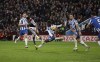 Aston Villa's Ollie Watkins scoring the opening goal during the Premier League match at Villa Park, Birmingham, Britain, Saturday Nov. 20, 2021. (Bradley Collyer/PA via AP)