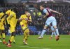 Burnley's Chris Wood, right, scores during the English Premier League soccer match between Burnley and Crystal Palace at Turf Moor, Burnley, England, Saturday Nov. 20, 2021. (Martin Rickett/PA via AP)