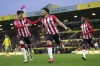 Southampton's Che Adams, center, celebrates scoring during the English Premier League soccer match between Norwich City and Southampton at Carrow Road, Norwich, England, Saturday Nov. 20, 2021. (Joe Giddens/PA via AP)
