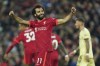 Liverpool's Mohamed Salah celebrates after scoring his side's third goal during the English Premier League soccer match between Liverpool and Arsenal at Anfield Stadium, Liverpool, England, Saturday, Nov. 20, 2021. (AP Photo/Jon Super)