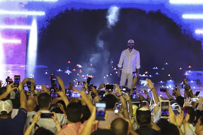 El Salvador's President Nayib Bukele participates in the closing ceremony of a congress for cryptocurrency investors in Santa Maria Mizata, El Salvador, Saturday, Nov. 20, 2021. Bukele announced during the rock concert-like atmosphere at the gathering that his government will build an oceanside