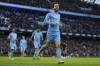 Manchester City's Bernardo Silva, right, celebrates after scoring his team third goal during the English Premier League soccer match between Manchester City and Everton at Etihad stadium in Manchester, England, Sunday, Nov. 21, 2021. (AP Photo/Jon Super)