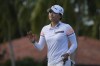 Jin Young Ko, of Korea, reacts to her putt on the 17th green during the final round of the LPGA Tour Championship golf tournament, Sunday, Nov. 21, 2021, in Naples, Fla. (AP Photo/Rebecca Blackwell)