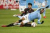 New York City FC midfielder Maxi Moralez, right, and Atlanta United midfielder Marcelino Moreno, top, battle for the ball during the second half of an MLS soccer match at Yankee Stadium, Sunday, Nov. 21, 2021, in New York. (AP Photo/Eduardo Munoz Alvarez)