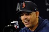 FILE - Boston Red Sox manager Alex Cora speaks to reporters prior to a baseball practice at Fenway Park, Sunday, Oct. 17, 2021, in Boston. The Red Sox have picked up Alex Cora’s option for two more seasons, rewarding their manager for taking them to the AL Championship Series in his first year back after serving his one-year sign-stealing suspension. (AP Photo/Robert F. Bukaty, File)