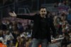Barcelona's head coach Xavi Hernandez gestures during a Spanish La Liga soccer match between FC Barcelona and RCD Espanyol at the Camp Nou stadium in Barcelona, Spain, Saturday, Nov. 20, 2021. (AP Photo/Joan Monfort)