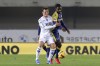 Empoli's Liam Henderson, left, and Verona's Adrien Tamezed vie for the ball during the Serie A soccer match between Hellas Verona and Empoli at the Marcantonio Bentegodi Stadium in Verona, Italy, Monday, Nov. 22, 2021. (Paola Garbuio/LaPresse via AP)