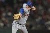 FILE - New York Mets pitcher Aaron Loup throws to a San Francisco Giants batter during a baseball game in San Francisco on Aug. 16, 2021. Loup has agreed to a $17 million, two-year deal with the Los Angeles Angels. The club announced the deal Monday for Loup. (AP Photo/Jeff Chiu, File)