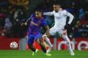 Barcelona's Memphis Depay, left, duels for the ball with Benfica's Nicolas Otamendi during a Group E Champions League soccer match between FC Barcelona and Benfica at Camp Nou stadium in Barcelona, Spain, Tuesday, Nov. 23, 2021. (AP Photo/Joan Monfort)