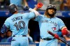 Toronto Blue Jays second baseman Marcus Semien (10) celebrates his solo home run with teammate Vladimir Guerrero Jr. (27) during fifth inning MLB baseball action against the Baltimore Orioles, in Toronto, Sunday, Oct. 3, 2021. A trio of Toronto Blue Jays has been named to the all-MLB first team, recognizing their stellar 2021 seasons. THE CANADIAN PRESS/Frank Gunn