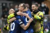 Inter Milan's Edin Dzeko, center, celebrates after scoring his side's first goal with teammates during the Champions League, Group D soccer match between Inter Milan and Shakhtar Donetsk at the San Siro stadium in Milan, Italy, Wednesday, Nov. 24, 2021. (AP Photo/Luca Bruno)