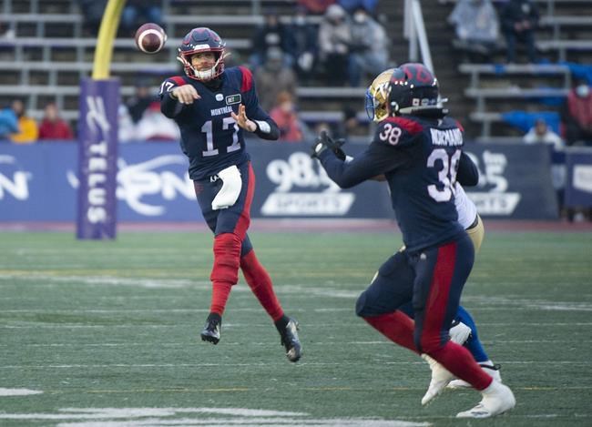 Montreal Alouettes quarterback Trevor Harris (17) throws a pass towards teammate Christophe Normand during second half CFL football action against the Winnipeg Blue Bombers in Montreal on November 13, 2021. THE CANADIAN PRESS/Graham Hughes