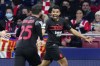 AC Milan's Junior Messias, right, celebrates after scoring the opening goal during a Group B Champions League soccer match between Atletico Madrid and AC Milan at the Wanda Metropolitano stadium in Madrid, Spain, Wednesday, Nov. 24, 2021. (AP Photo/Manu Fernandez)