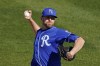 FILE - Kansas City Royals' Wade Davis throws during the fifth inning of a spring training baseball game against the Texas Rangers Sunday, Feb. 28, 2021, in Surprise, Ariz. Free agent pitcher Wade Davis, a three-time All-Star, is retiring after 13 major league seasons at age 36. His retirement was announced by his agency, Jet Sports, the Kansas City Royals said Wednesday, Nov. 24, 2021. (AP Photo/Charlie Riedel, File)