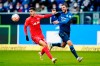 Leipzig's Andre Silva, left, and Hoffenheim's Florian Grillitsch fight for the ball during a German Bundesliga soccer match between TSG 1899 Hoffenheim and RB Leipzig in Sinsheim, Germany, Saturday, Nov.10, 2021. (Uwe Anspach/dpa via AP)