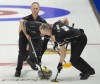 Skip Brad Jacobs looks on as lead Ryan Harnden and second E.J. Harnden sweep his rock during draw 14 against team Koe at the Tim Hortons Curling Trials in Saskatoon in this Thursday, November 25, 2021 handout photo. THE CANADIAN PRESS/HO, Michael Burns, Curling Canada *MANDATORY CREDIT*
