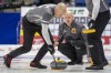 Team Koe skip Kevin Koe throws against Team Gunnlaugson during Draw 16 of the 2021 Canadian Olympic curling trials in Saskatoon, Friday, November 26, 2021. THE CANADIAN PRESS/Liam Richards