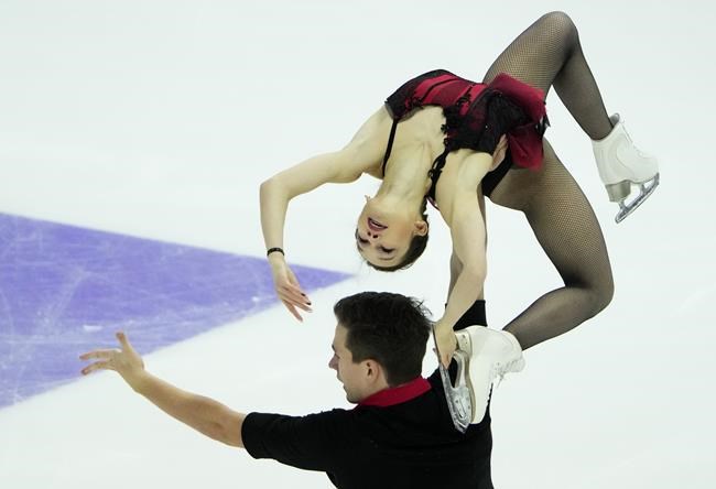 Russia's Daria Pavliuchenko and Denis Khodykin perform in the pairs short program during the ISU Grand Prix of Figure Skating Rostelecom Cup in Sochi, Russia, Friday, Nov. 26, 2021. (AP Photo/Alexander Zemlianichenko)