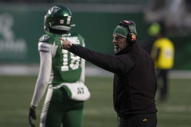 Saskatchewan Roughriders head coach Craig Dickenson points on the sidelines during the second half of CFL football action against the Edmonton Elks in Regina, Saturday, Nov. 13, 2021. Dickenson knows who his starter will be for the West Division semifinal Sunday but the Saskatchewan Roughriders head coach will need a bit more time to determine who'll back up Cody Fajardo. THE CANADIAN PRESS/Kayle Neis