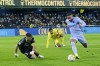 Barcelona's Memphis Depay takes the ball around Villarreal's goalkeeper Geronimo Rulli on his way to scoring his side's second goal during the La Liga soccer match between Villarreal and Barcelona in Villarreal, Spain, Saturday, Nov. 27, 2021. (AP Photo/Alberto Saiz)