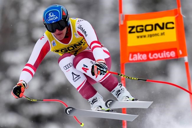 Matthias Mayer of Austria flies down the course during FIS downhill skiing race action, in Lake Louise, Alta., Saturday, Nov. 27, 2021. THE CANADIAN PRESS/Frank Gunn