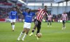 Brentford's Ivan Toney, right and Everton's Allan battle for the ball, during the English Premier League soccer match between Brentford and Everton, at Brentford Community Stadium, in London, Sunday, Nov. 28, 2021. (John Walton/PA via AP)
