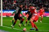 Frankfurt's Filip Kostic, left, and Union's Robin Knoche fight for the ball during the German Bundesliga soccer match between Eintracht Frankfurt and Union Berlin, in Frankfurt, Germany, Sunday, Nov. 28, 2021. (Arne Dedert/dpa via AP)