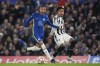 Chelsea's Hakim Ziyech, left, is challenged by Juventus' Weston McKennie during the Champions League group H soccer match between Chelsea and Juventus at Stamford Bridge stadium in London, Tuesday, Nov. 23, 2021. (AP Photo/Matt Dunham)