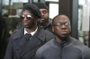 FILE - Brothers Olabinjo Osundairo, right, and Abimbola Osundairo, appear outside the Leighton Criminal Courthouse in Chicago, Feb. 24, 2020. The trial of actor Jussie Smollett will boil down to the question of whether the jury believes the actor's version of what he says was a racist and homophobic attack or that told by the two brothers who say they helped the actor fake the attack. Abimbola and Olabinjo Osundairo admit they took part in the “attack” that made headlines around the world but say Smollett planned the whole thing and paid them to do it. The trial starts with jury selection Monday, Nov 29, 2021 and is expected to last a week. (AP Photo/Charles Rex Arbogast, file)