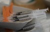 Needles are seen filled with the vaccination for COVID-19 at a truck stop along highway 91 North in Delta, B.C., on June 16, 2021. THE CANADIAN PRESS/Jonathan Hayward