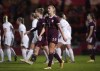 Latvia's Ligita Tumane looks dejected as England score their twentieth goal during the Women's FIFA World Cup Qualifying - Group D soccer match between England and Latvia at the Keepmoat Stadium, Doncaster, England, Tuesday Nov. 30, 2021. (Tim Goode/PA via AP)