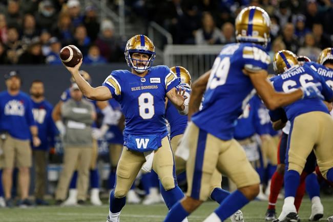 Winnipeg Blue Bombers quarterback Zach Collaros (8) throws during the first half of CFL action against the Montreal Alouettes in Winnipeg on November 6, 2021. THE CANADIAN PRESS/John Woods