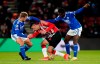 Southampton's Armando Broja, center, battles for the ball with Leicester City's Kiernan Dewsbury-Hall, left, and Wilfred Ndidi during the English Premier League soccer match between Southampton and Leicester City at St Mary's Stadium, Southampton, England, Wednesday Dec. 1, 2021. (Andrew Matthews/PA via AP)