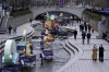 People wearing face masks to help protect against the spread of the coronavirus walk by lanterns at the public stream in Seoul, South Korea, Thursday, Dec. 2, 2021. South Korea broke its daily record for coronavirus infections for a second straight day on Thursday with more than 5,200 new cases, as pressure mounted on a health care system grappling with rising hospitalizations and deaths. (AP Photo/Ahn Young-joon)