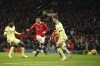 Manchester United's Cristiano Ronaldo scores his side's second goal during the English Premier League soccer match between Manchester United and Arsenal at Old Trafford stadium in Manchester, England, Thursday, Dec. 2, 2021. (AP Photo/Dave Thompson)