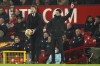 Manchester United's interim coach Michael Carrick, left, and Arsenal's manager Mikel Arteta stand on the touchline during the English Premier League soccer match between Manchester United and Arsenal at Old Trafford stadium in Manchester, England, Thursday, Dec. 2, 2021. (AP Photo/Dave Thompson)