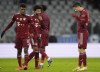 Bayern's Kingsley Coman, left and Bayern's Robert Lewandowski reacts at the end of the match in the German Bundesliga soccer match between Bayern Munich and Arminia Bielefeld, in Munich, Saturday, Nov. 27, 2021. Bayern won the game 1-0. (AP Photo/Martin Meissner)