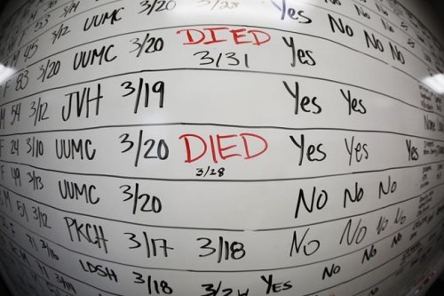 FILE - This May 13, 2020, file photo taken with a fisheye lens shows a list of the confirmed COVID-19 cases in Salt Lake County early in the coronavirus pandemic at the Salt Lake County Health Department, in Salt Lake City. The arrival of the omicron variant of the coronavirus in the U.S. has health officials in some communities reviving contact tracing operations in an attempt to slow and better understand its spread as scientists study how contagious it is and whether it can thwart vaccines. (AP Photo/Rick Bowmer, File)